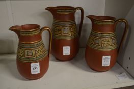 Graduated set of three Greek revival terracotta jugs.