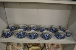 A set of ten Chinese blue and white coffee cups and saucers and a pair of matching cups.