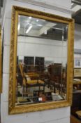 A decorative gilt framed mirror.