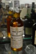 A bottle of Usher's old vatted Glenlivet whisky.