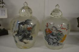 A pair of large reverse painted Chinese glass snuff bottles.