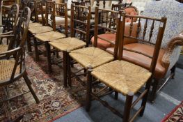 Six 19th century spindleback ash rush seated dining chairs.