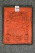 An unusual Indian or Tibetan relief moulded plaque.