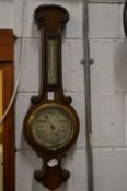 A barometer/thermometer.