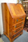 A small yew wood bureau.