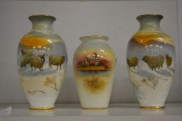 A pair of small Royal Doulton vases decorated with sheep in a snowy landscape together with a