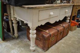 A pine and painted pine two drawer side table.