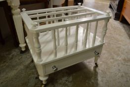 A white painted canterbury.