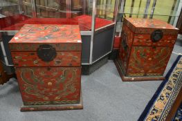 A pair of Chinese dragon decorated red lacquer storage chests.