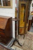 A mahogany torchere style floor standing lamp.