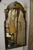 A chinoiserie decorated black lacquer pier mirror.