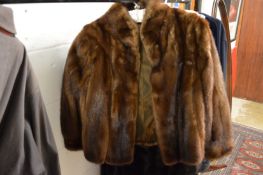A mink jacket and a full length fur coat.