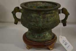 A small Chinese bronze censer on stand.