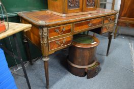 A French mahogany and ormolu mounted writing table.