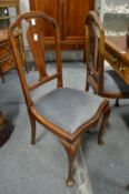 A pair of mahogany occasional chairs.