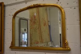 Gilt framed over mantel mirror.