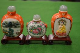 Three Chinese snuff bottles.