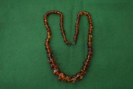 An amber bead necklace.
