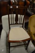 A pair of Edwardian mahogany occasional chairs and two other chairs.