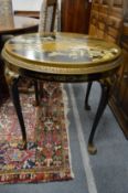 A chinoiserie decorated black lacquer circular occasional table.