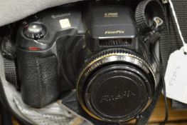 A cased camera and a cased video camera.