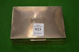 A silver cigarette box.