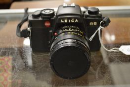 A Leica R5 camera and lens.