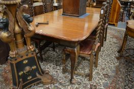 A good walnut extending dining table with one leaf on cabriole legs, extended size 240cm x 120cm.