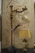 A pair of unusual Italian style carved gilt wood and gesso floor standing lamps (faults).