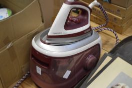 A Philips iron with stand etc.