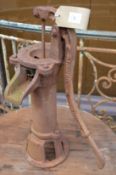 An ornamental cast iron garden pump.