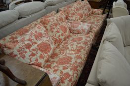 A pair of floral upholstered classical style two seater settee's.