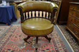 A good leather upholstered mahogany framed tub shaped desk chair.