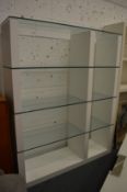 A Calligaris room divider style white lacquer and glass three tier unit.