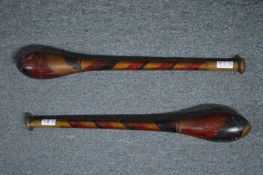 A pair of old exercise clubs.