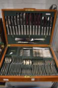 A good Harrods mahogany cased eight place canteen of cutlery.