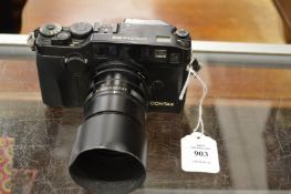 A Contax G2 camera and Carl Zeiss lens.