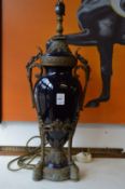 A good pair of blue porcelain and ormolu urn shaped lamps.