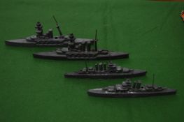 Four cast metal boats.