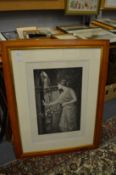 A classical female figure by a doorway, a print signed J W Waterhouse and three further prints.
