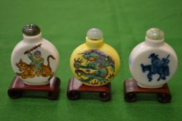 Three Chinese snuff bottles.