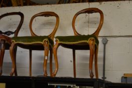 A pair of Victorian walnut dining chairs.