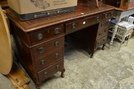 A Victorian walnut pedestal desk.
