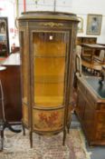 A French ormolu mounted bow fronted Vitrine.