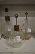 Three scientific experimental jars.