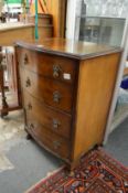 A small walnut serpentine fronted four drawer chest.