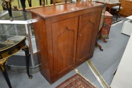A mahogany two door cupboard.