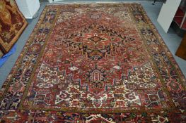 A good Persian design carpet, red ground with all over stylised decoration 325cm x 235cm.