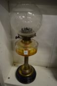 Brass and glass oil lamp.
