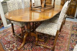 A good oak pedestal dining table with two leaves.